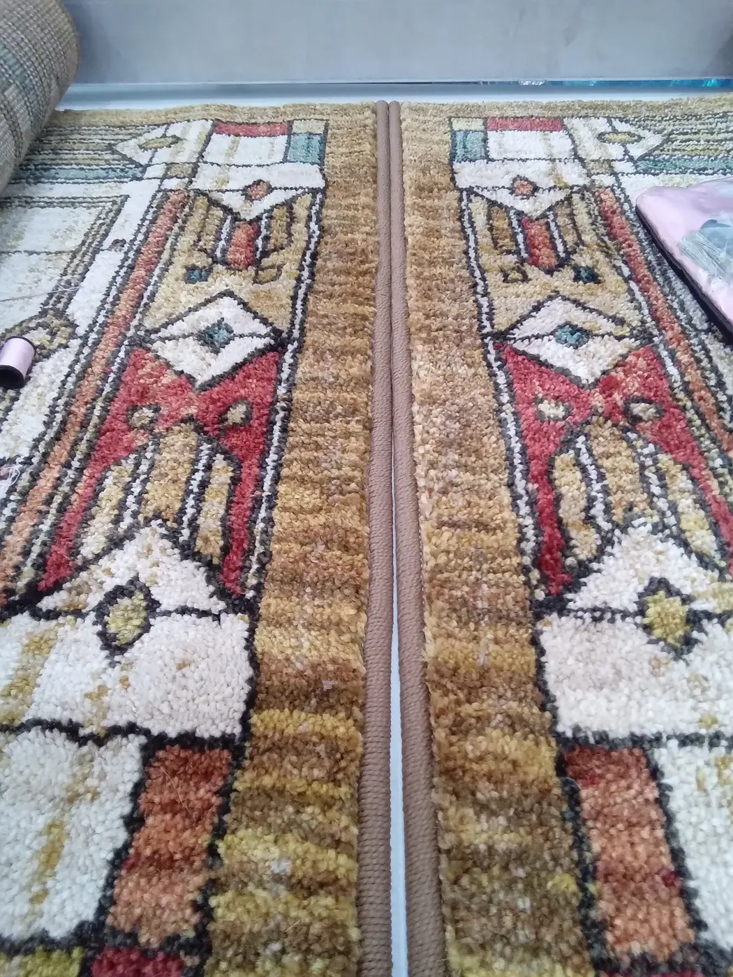 Close-up of hand-knotted wool pile and pattern in an area rug